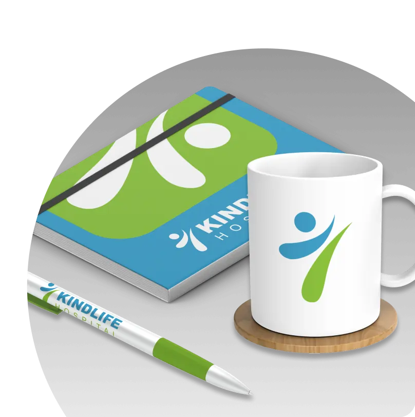 Branded promotional items including a notebook, pen and mug.